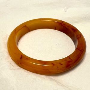 Vintage butterscotch yellow Bakelite (tested) bangle with cherry red veins.